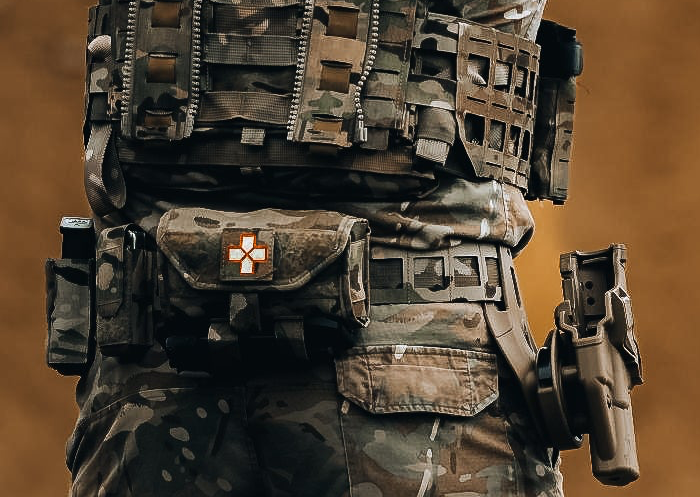 Solider in mtp uniform and British army kit at the pistol range